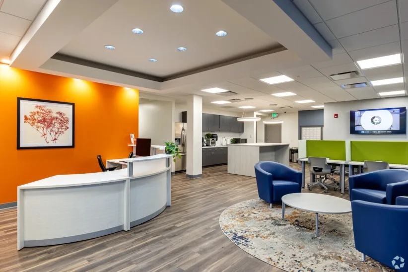 Staffed reception desk and lounge seating